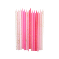 Birthday candles in varying shades of pink